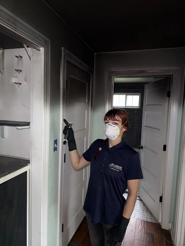 Ace Flood & Water Damage Restoration technician in protective gear on a job in Carlsbad